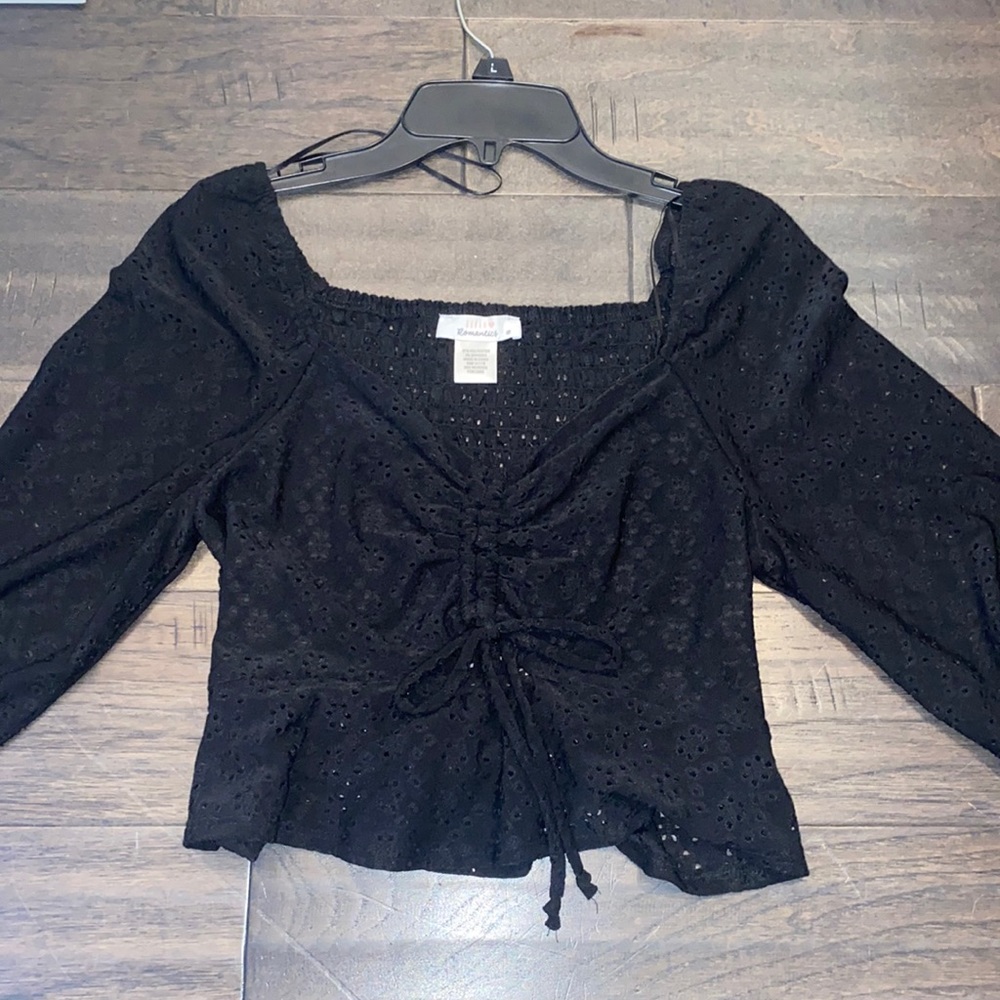 cute black shirt, kind of see through on arms, stretchy, never worn